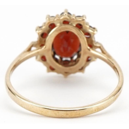 3371 - 9ct gold garnet cluster ring, size P, 2.1g