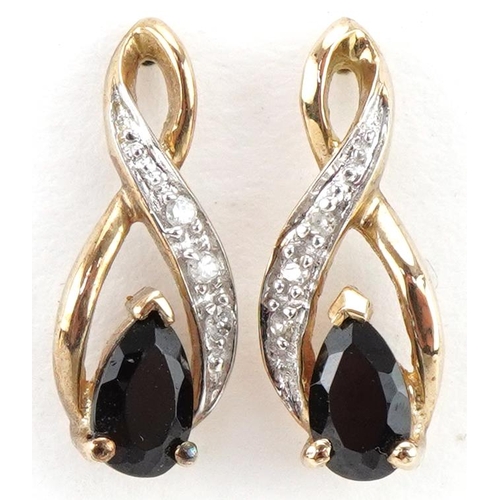 3312 - Pair of 9ct gold diamond and black stone crossover stud earrings, each 1.3cm high, total 1.1g