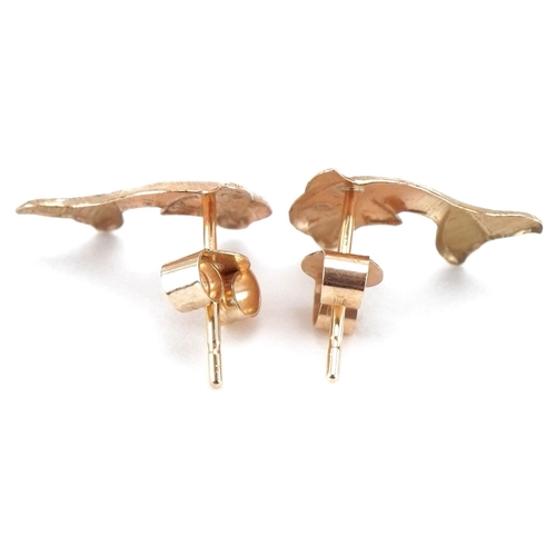 3293 - Pair of unmarked gold dolphin stud earrings, each 9.5mm high, total 0.2g