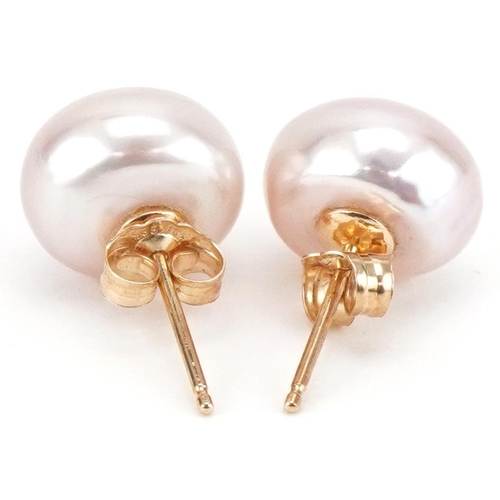 3386 - Pair of 9ct gold pink freshwater pearl stud earrings, each approximately 11mm in diameter, total 3.1... 