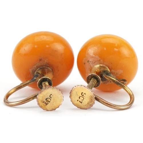 3277 - Pair of 9ct gold butterscotch amber coloured earrings with screw backs, each 1.2cm in diameter, tota... 