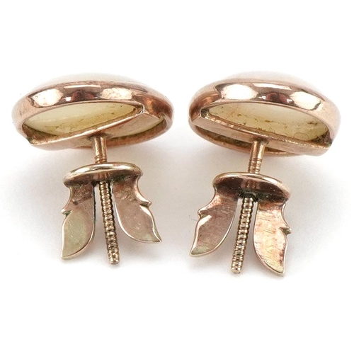 3395 - Pair of unmarked gold cabochon opal earrings with screw backs, each approximately 1.4cm x 1.1cm, tot... 