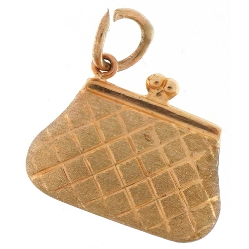 3412 - 9ct gold charm in the form of a ladies clutch bag, 1.7cm wide, 1.0g