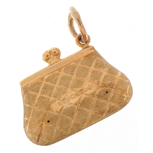 3412 - 9ct gold charm in the form of a ladies clutch bag, 1.7cm wide, 1.0g