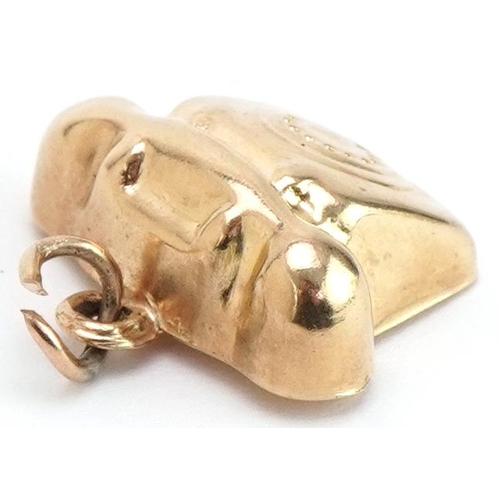 3443 - 9ct gold charm in the form of a vintage dial telephone, 1.7cm wide, 1.2g