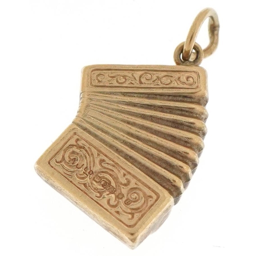 3164 - 9ct gold charm in the form of an accordion, 1.6cm wide, 1.0g