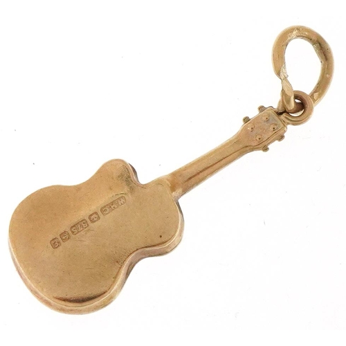 3360 - 9ct gold charm in the form of a guitar, 2.1cm high, 0.6g