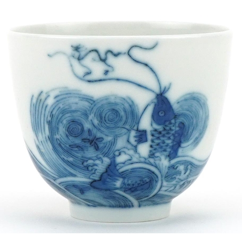 1108 - Chinese blue and white porcelain tea bowl hand painted with fish and script, six figure character ma... 