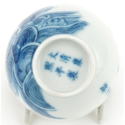 1108 - Chinese blue and white porcelain tea bowl hand painted with fish and script, six figure character ma... 