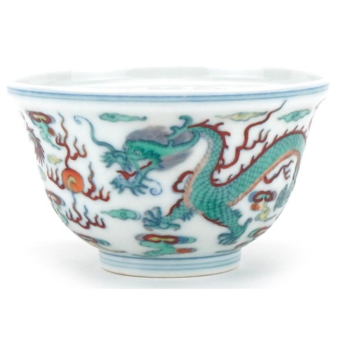 1149 - Chinese porcelain footed bowl hand painted with dragons chasing the flaming pearl, six figure charac... 