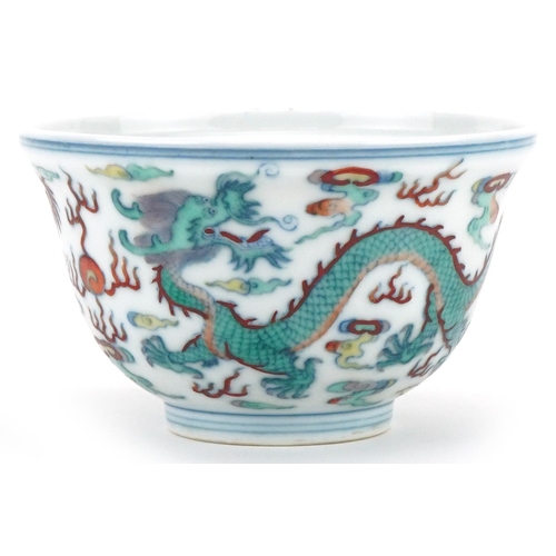 1149 - Chinese porcelain footed bowl hand painted with dragons chasing the flaming pearl, six figure charac... 