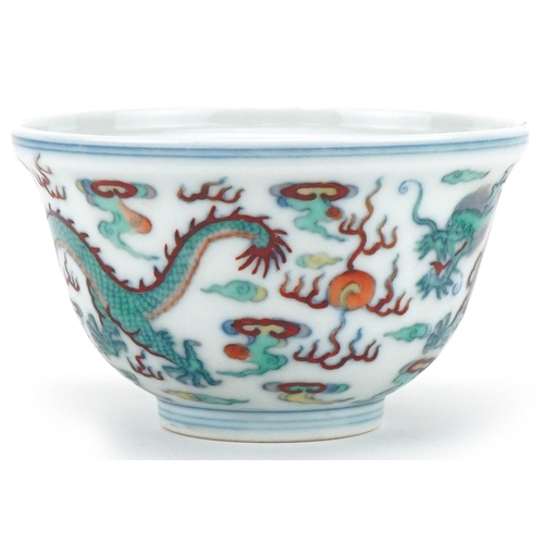 1149 - Chinese porcelain footed bowl hand painted with dragons chasing the flaming pearl, six figure charac... 