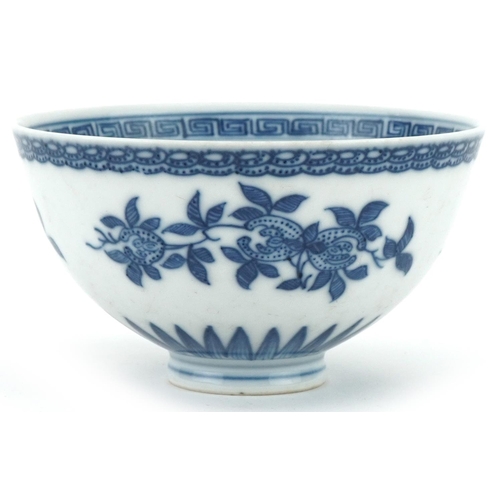 1061 - Chinese blue and white porcelain footed bowl hand painted with flowers, 10.5cm in diameter