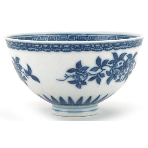 1061 - Chinese blue and white porcelain footed bowl hand painted with flowers, 10.5cm in diameter