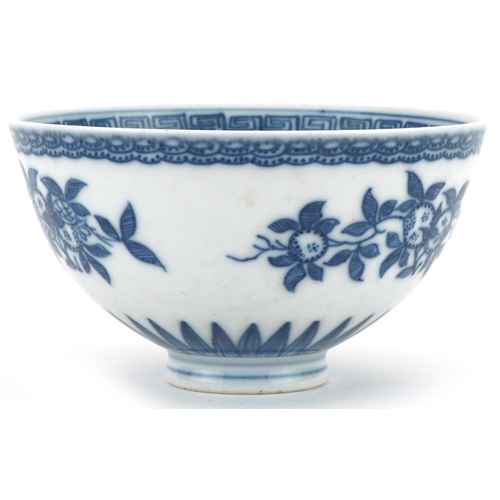 1061 - Chinese blue and white porcelain footed bowl hand painted with flowers, 10.5cm in diameter