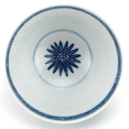 1061 - Chinese blue and white porcelain footed bowl hand painted with flowers, 10.5cm in diameter