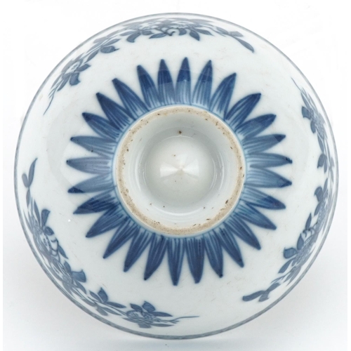 1061 - Chinese blue and white porcelain footed bowl hand painted with flowers, 10.5cm in diameter