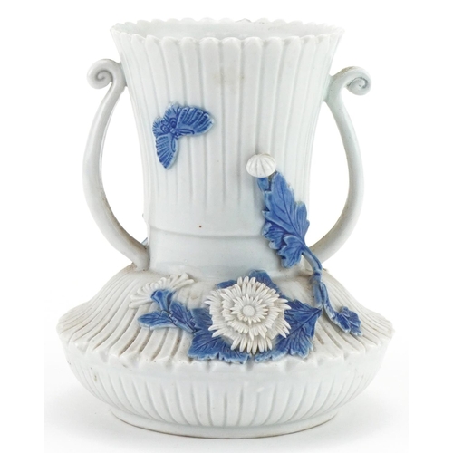 1351 - Chinese porcelain vase with twin handles, relief decorated with flowers and foliage, 12cm high