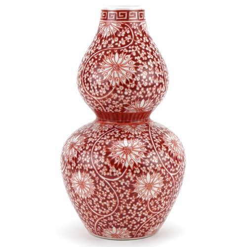 1302 - Chinese porcelain double gourd vase hand painted in iron red with flowers and foliage, six figure ch... 