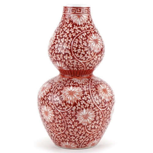 1302 - Chinese porcelain double gourd vase hand painted in iron red with flowers and foliage, six figure ch... 