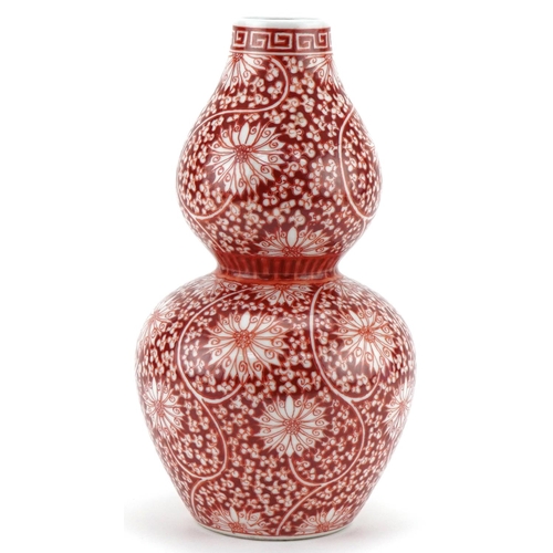 1302 - Chinese porcelain double gourd vase hand painted in iron red with flowers and foliage, six figure ch... 