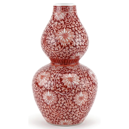 1302 - Chinese porcelain double gourd vase hand painted in iron red with flowers and foliage, six figure ch... 