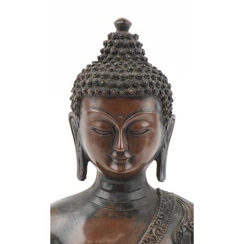 1356 - Large Tibetan patinated bronze Buddha seated in the lotus position, 42cm high