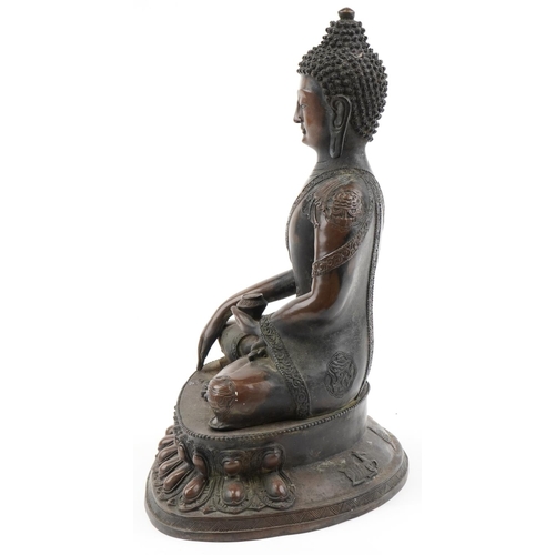 1356 - Large Tibetan patinated bronze Buddha seated in the lotus position, 42cm high