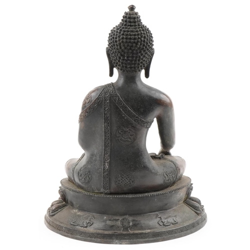 1356 - Large Tibetan patinated bronze Buddha seated in the lotus position, 42cm high