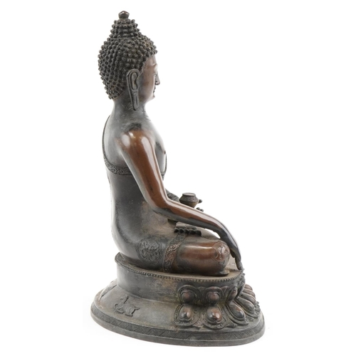 1356 - Large Tibetan patinated bronze Buddha seated in the lotus position, 42cm high