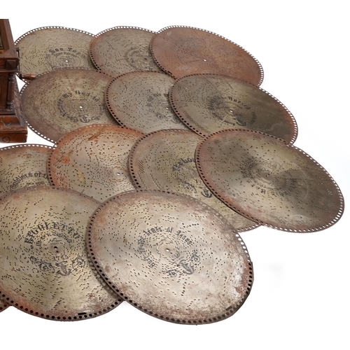 1432 - Victorian walnut polyphone inlaid with floral panel along with twenty three 40cms metal discs, 35cm ... 