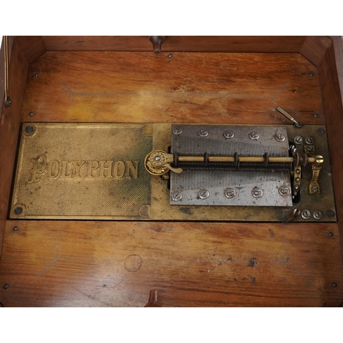 1432 - Victorian walnut polyphone inlaid with floral panel along with twenty three 40cms metal discs, 35cm ... 