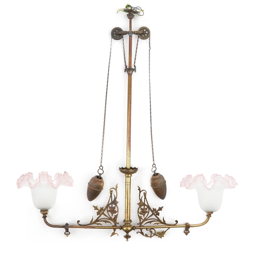 92 - Arts & Crafts brass rise and fall ceiling light fitting with pink frosted glass shades, 91cm high