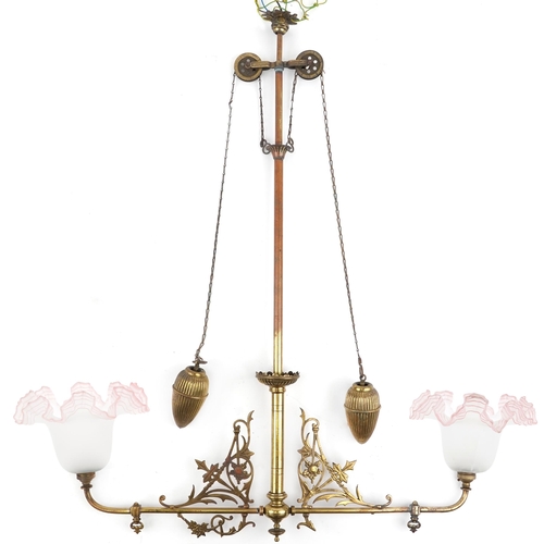 92 - Arts & Crafts brass rise and fall ceiling light fitting with pink frosted glass shades, 91cm high