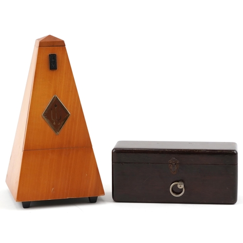 1454 - Two music interest metronomes by Wittner & Paquet, the largest 21cm high