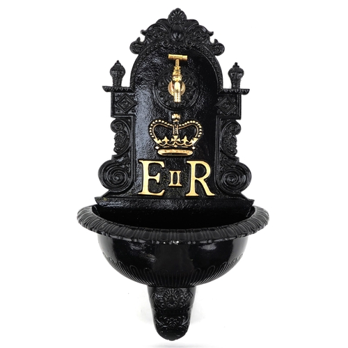 2272 - Elizabeth II painted metal wall mounted water font, 70cm high