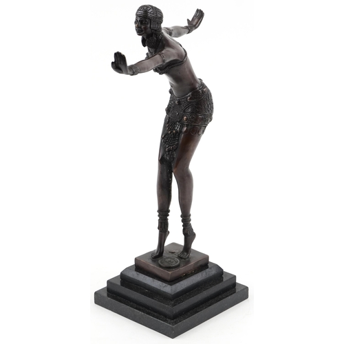 1005 - Patinated bronze figurine of an Art Deco female raised on a black marble stepped base, 41cm high