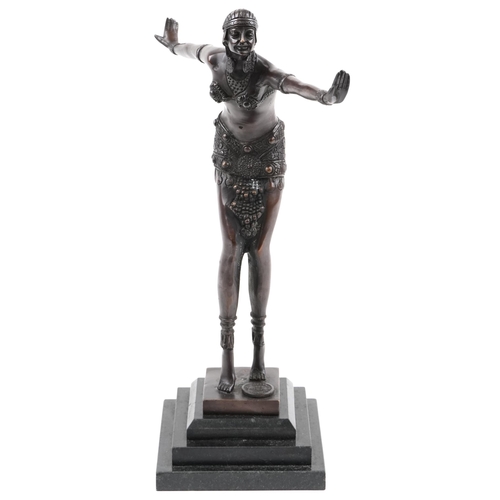 1005 - Patinated bronze figurine of an Art Deco female raised on a black marble stepped base, 41cm high