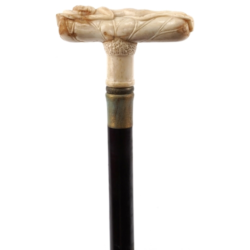 2306 - Hardwood walking stick with bone handle carved with sleeping nude figure, 91cm in length