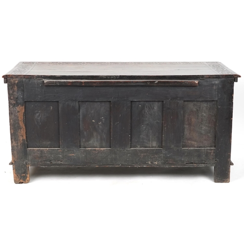 660 - Late 18th century and later oak triple panel coffer profusely carved, 73cm H x 147cm W x 58cm D