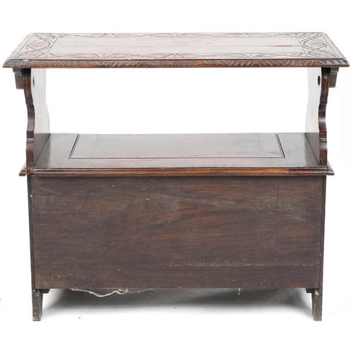 665 - Late Victorian oak monk's bench, the box seat above a carved panel front, 74cm H x 87cm W x 43cm D