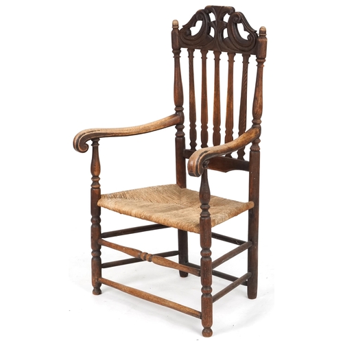 693 - 19th century oak scroll arm country chair with rush seat, 120cm H x 73cm W x 44cm D