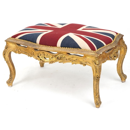 708 - 20th century carved giltwood serpentine fronted stool, overstuffed and upholstered in a Union Jack s... 