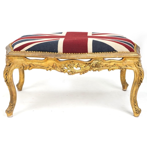 708 - 20th century carved giltwood serpentine fronted stool, overstuffed and upholstered in a Union Jack s... 