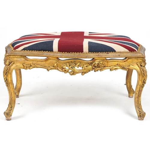 708 - 20th century carved giltwood serpentine fronted stool, overstuffed and upholstered in a Union Jack s... 