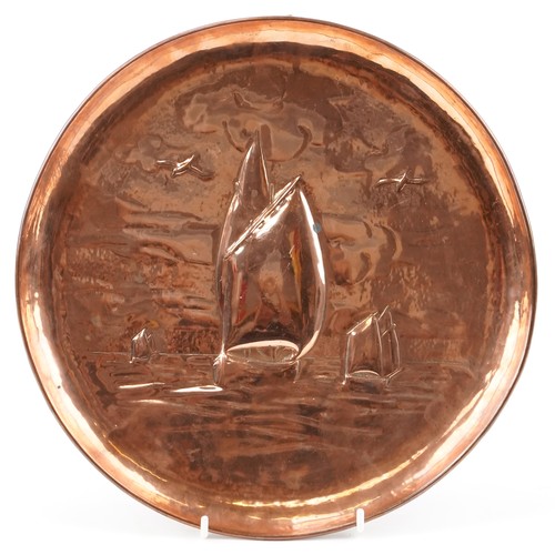 347 - Newlyn Arts & Crafts circular copper card tray decorated with a Lugger, 27cm in diameter