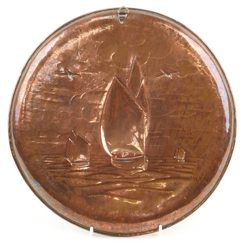 347 - Newlyn Arts & Crafts circular copper card tray decorated with a Lugger, 27cm in diameter