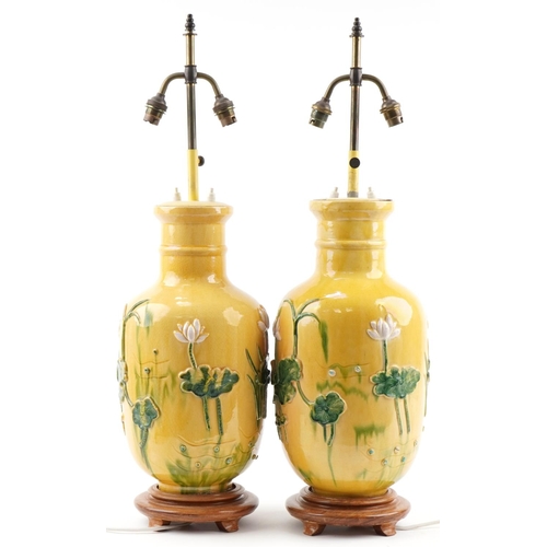 2170A - Pair of Chinese porcelain vase table lamps relief decorated with waterlilies, each overall 77cm high