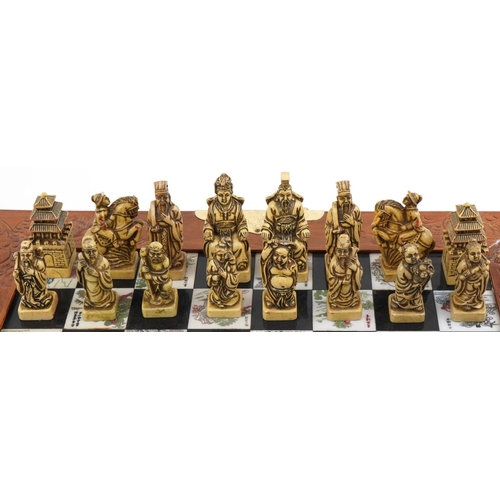 2328 - Chinese hardwood folding chess set, 36cm x 36cm