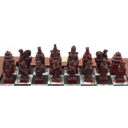 2328 - Chinese hardwood folding chess set, 36cm x 36cm